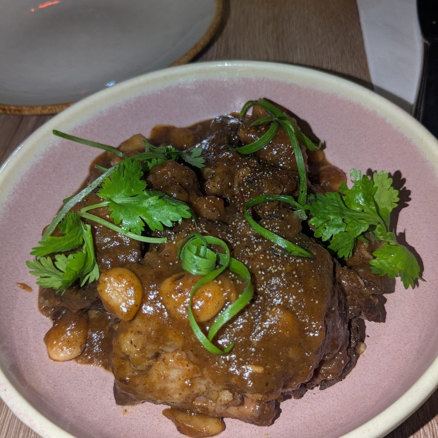 Oxtails with butter beans, cilantro and scallion